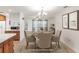 Staged dining room with elegant decor and natural lighting at 7378 Ne 49Th Ln, Wildwood, FL 34785