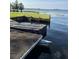 Scenic view of the lake from the boat dock on the property, perfect for lakeside enjoyment at 7378 Ne 49Th Ln, Wildwood, FL 34785