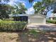 Charming single-story home with a well-maintained lawn and an attached two-car garage at 7378 Ne 49Th Ln, Wildwood, FL 34785