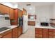Functional kitchen with ample cabinet space and tile flooring at 7378 Ne 49Th Ln, Wildwood, FL 34785