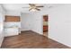 Laundry room features a folding counter, cabinets, and wood-look flooring at 7378 Ne 49Th Ln, Wildwood, FL 34785