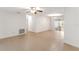 Open-concept living room with tile flooring and access to other rooms at 7378 Ne 49Th Ln, Wildwood, FL 34785