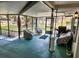 Relaxing screened-in patio with comfortable seating, perfect for enjoying the outdoors at 7378 Ne 49Th Ln, Wildwood, FL 34785