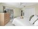 Light-filled bedroom with sliding doors to the patio at 762 Turbeville Ter, The Villages, FL 32162