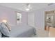 Bedroom with a lavender wall, carpet and a closet at 762 Turbeville Ter, The Villages, FL 32162