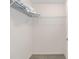 Walk-in closet with shelf and carpet at 762 Turbeville Ter, The Villages, FL 32162