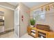 Additional laundry area includes storage cabinet, hanging rack and plenty of space for organization at 762 Turbeville Ter, The Villages, FL 32162