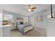 Serene main bedroom with light blue walls, soft carpet, and lots of natural light at 762 Turbeville Ter, The Villages, FL 32162