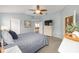Comfortable main bedroom featuring light blue walls, a ceiling fan, and neutral carpet at 762 Turbeville Ter, The Villages, FL 32162