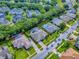 An aerial view of a home with a screened pool, lush greenery, and a well-maintained lawn at 812 Eagle Claw Ct, Lake Mary, FL 32746