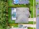 Aerial view of a home with a screened pool, well-kept landscaping, and a defined property line at 812 Eagle Claw Ct, Lake Mary, FL 32746