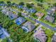Aerial view showcases property, pool, landscaping, and neighborhood amenities like a golf course at 812 Eagle Claw Ct, Lake Mary, FL 32746