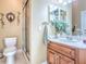 Well-lit bathroom featuring a stylish vanity with wooden cabinets and a glass-enclosed shower at 812 Eagle Claw Ct, Lake Mary, FL 32746