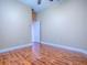 Bedroom with wood-look flooring, neutral paint, and a closet door leading to other room at 812 Eagle Claw Ct, Lake Mary, FL 32746