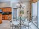 Elegant dining room with chandelier and wood cabinets in background at 812 Eagle Claw Ct, Lake Mary, FL 32746