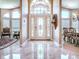Bright foyer with elegant marble flooring and a decorative front door at 812 Eagle Claw Ct, Lake Mary, FL 32746