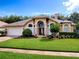 Charming single-story home featuring a well-manicured lawn and lush landscaping at 812 Eagle Claw Ct, Lake Mary, FL 32746