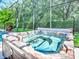A screened-in hot tub is a great space to enjoy the outdoors, relax, and socialize with friends and Gathering at 812 Eagle Claw Ct, Lake Mary, FL 32746