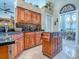 Kitchen with custom cabinetry, dark countertops, and a view into the dining room at 812 Eagle Claw Ct, Lake Mary, FL 32746