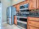 Well-equipped kitchen features stainless steel appliances and wood cabinets at 812 Eagle Claw Ct, Lake Mary, FL 32746