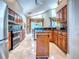 Open kitchen design with island, wood cabinets, and natural light at 812 Eagle Claw Ct, Lake Mary, FL 32746