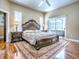 Spacious main bedroom with a decorative rug, and sliding door access to the patio at 812 Eagle Claw Ct, Lake Mary, FL 32746