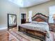 Elegant main bedroom featuring hardwood floors, a large mirror, and a walk-in closet at 812 Eagle Claw Ct, Lake Mary, FL 32746