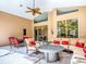Inviting screened patio with comfortable seating and stylish fire pit table at 812 Eagle Claw Ct, Lake Mary, FL 32746
