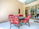 Comfortable patio seating area with views through sliding glass doors at 812 Eagle Claw Ct, Lake Mary, FL 32746