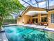Enjoy outdoor living at its finest in this screened-in pool area with a covered lanai and lush greenery at 812 Eagle Claw Ct, Lake Mary, FL 32746