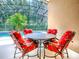 Screened pool area featuring red cushioned chairs at 812 Eagle Claw Ct, Lake Mary, FL 32746