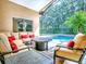 Inviting screened patio with comfortable seating and a refreshing swimming pool at 812 Eagle Claw Ct, Lake Mary, FL 32746