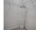 Bright walk-in closet featuring a corner shelving unit and white-painted walls at 865 Conroe St, The Villages, FL 34762