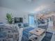 Inviting open-concept living space with kitchen and dining views, featuring comfortable seating and modern decor at 865 Conroe St, The Villages, FL 34762