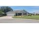Well-maintained single-story home featuring a screened-in porch, two car garage and lovely landscaping at 8980 Se 176Th Limerick Ln, The Villages, FL 32162