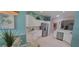 Bright open kitchen features white cabinets, stainless steel appliances and a large island at 8980 Se 176Th Limerick Ln, The Villages, FL 32162