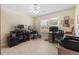 Office space featuring tile flooring, neutral walls, and a large window at 8980 Se 176Th Limerick Ln, The Villages, FL 32162