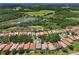 Enjoy this community's beautiful scenery, ponds, and mature trees from above at 9307 San Jose Blvd, Howey In The Hills, FL 34737