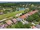 Enjoy this community's beautiful golf course, ponds, and mature trees from above at 9307 San Jose Blvd, Howey In The Hills, FL 34737