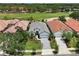 Enjoy this community's beautiful golf course, with views of ponds and many mature trees from above at 9307 San Jose Blvd, Howey In The Hills, FL 34737