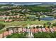 Enjoy this community's beautiful golf course, with views of ponds and many mature trees from above at 9307 San Jose Blvd, Howey In The Hills, FL 34737