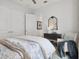 Neutral bedroom featuring double closets, accent chair, and neutral finishes at 9307 San Jose Blvd, Howey In The Hills, FL 34737