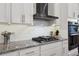 Updated kitchen with granite countertops, stainless steel appliances, and white subway tile backsplash at 9307 San Jose Blvd, Howey In The Hills, FL 34737