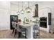Modern kitchen with granite countertops, stainless steel appliances, and seating at the island at 9307 San Jose Blvd, Howey In The Hills, FL 34737