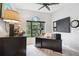 Bright office with a large window, black desk and furnishings, and neutral colors at 9307 San Jose Blvd, Howey In The Hills, FL 34737