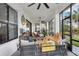 Spacious screened patio offers stylish seating and decor and views of the beautifully landscaped backyard at 9307 San Jose Blvd, Howey In The Hills, FL 34737