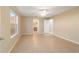 This spacious bedroom has tile floors, a ceiling fan, and neutral walls at 997 Nash Loop, The Villages, FL 32162