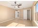 Neutral bedroom featuring a ceiling fan and a closet at 997 Nash Loop, The Villages, FL 32162