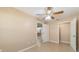 Neutral bedroom featuring a ceiling fan and a closet at 997 Nash Loop, The Villages, FL 32162