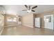 Open living room with tile flooring and neutral walls at 997 Nash Loop, The Villages, FL 32162